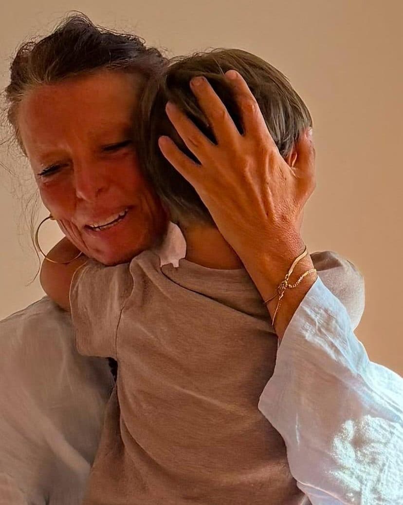 Beatrix hugging a child